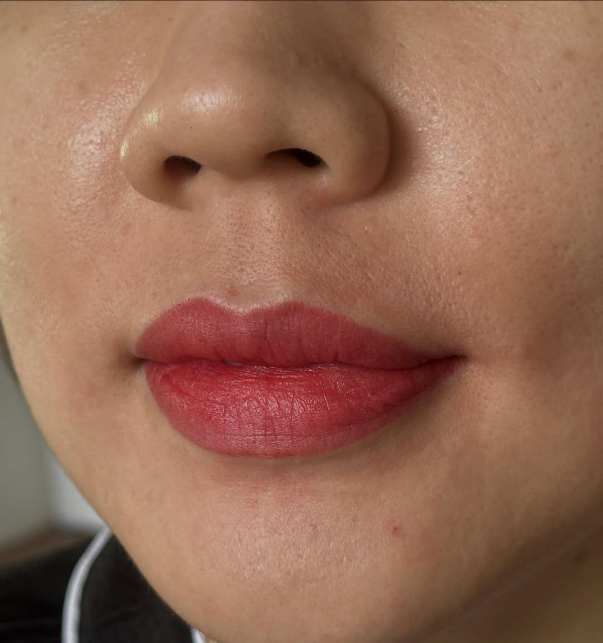 close up lip tattoo healed skin