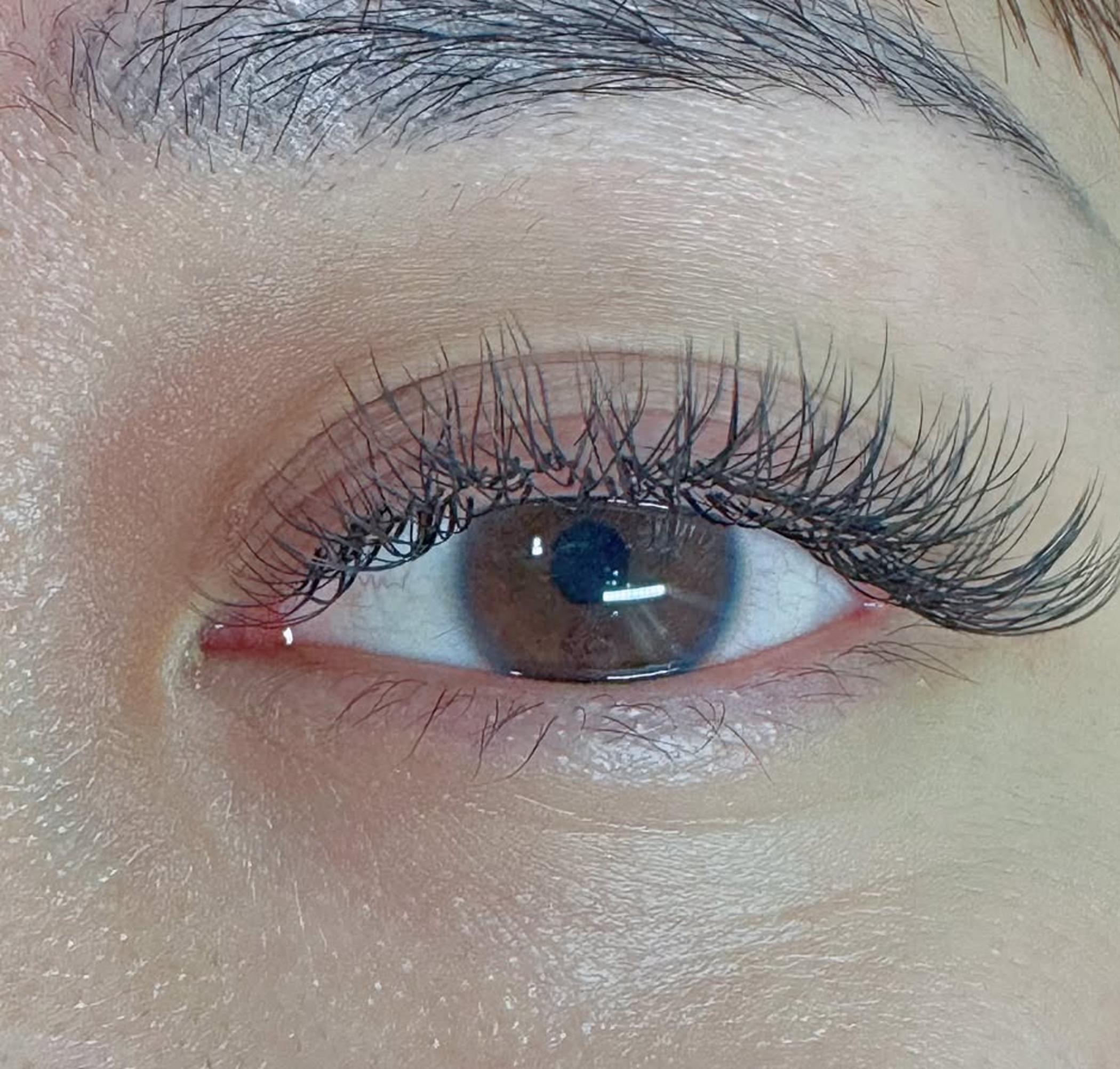 experienced technician applying lip pigment